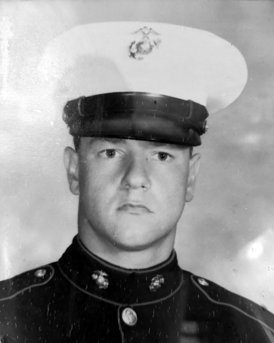 Private First Class Daniel R. Nelson in Marine Corps dress blues, from the portrait that hangs in the Post hall.